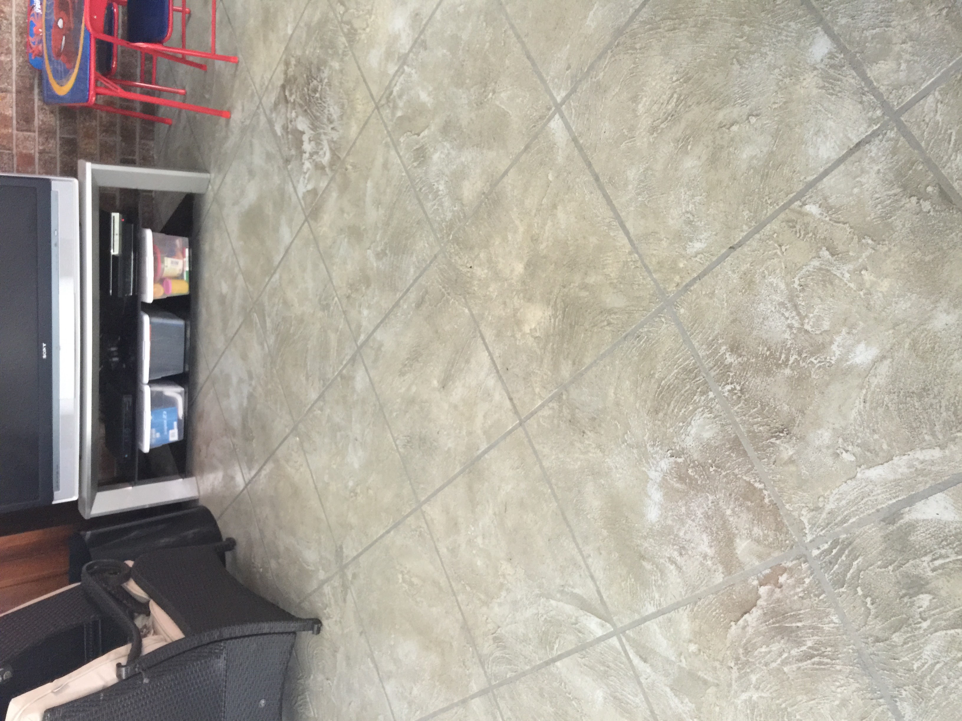 Decorative tile pattern concrete floor in residential room Savannah GA